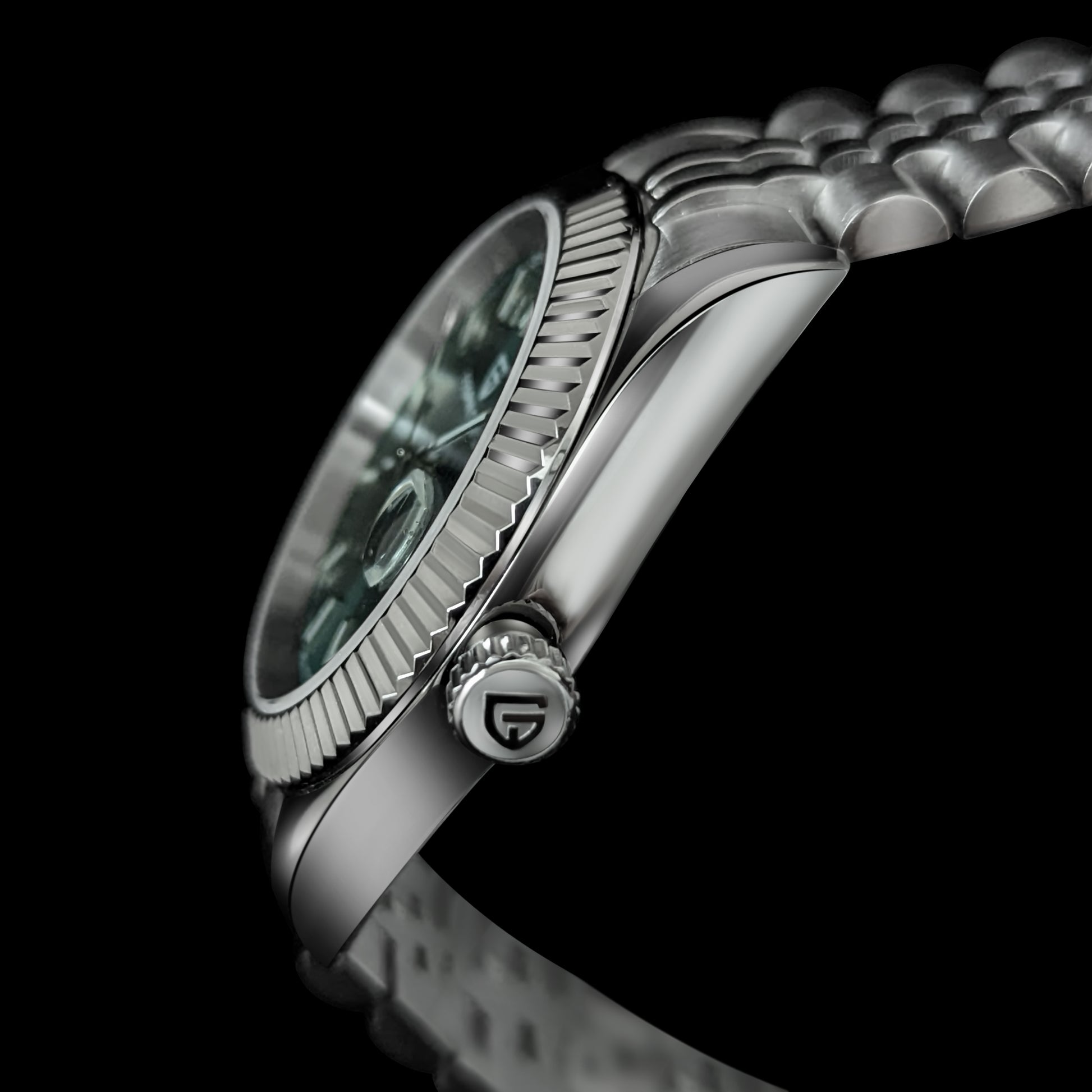 Side view of silver bracelet watch with green dial