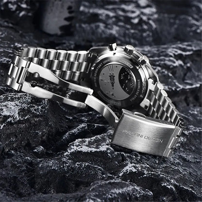 Watch bracelet and clasp resting on dark textured surface