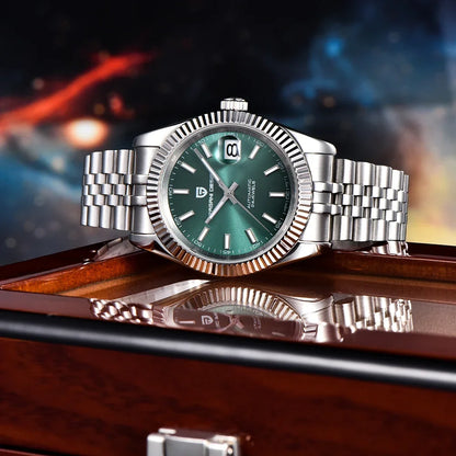 Silver bracelet watch with green dial on reflective surface